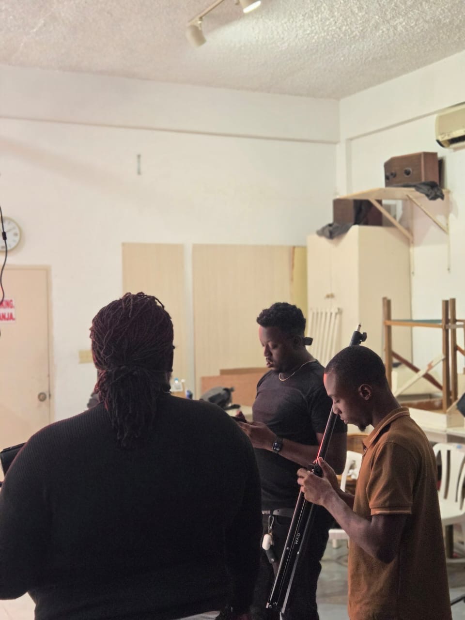 Promaxx preparing a production setup with crew in the studio