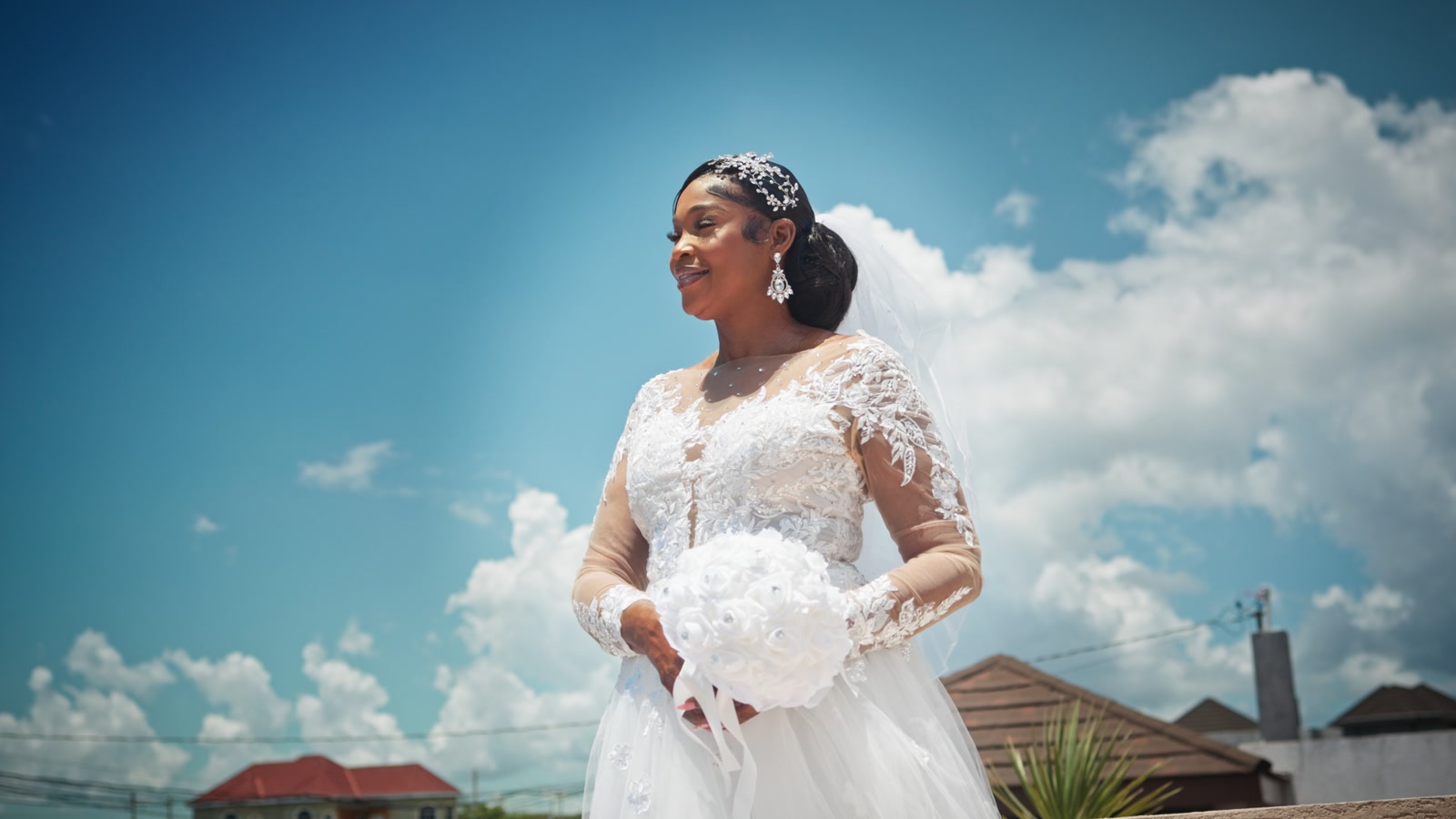 Cindy with her bouquet beneath the blue sky